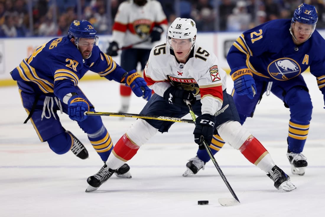 Apr 3, 2022; Buffalo, New York, USA; Florida Panthers center Anton Lundell (15) skates up ice with the puck as Buffalo Sabres left wing Zemgus Girgensons (28) defends during the first period at KeyBank Center. Mandatory Credit: Timothy T. Ludwig-USA TODAY Sports