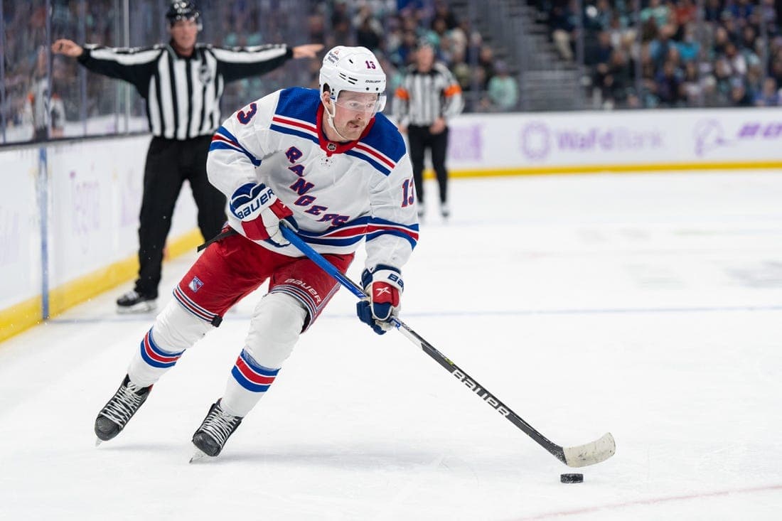 Nov 17, 2022; Seattle, Washington, USA; New York Rangers forward Alexis Lafreniere (13) skates with the puck against the Seattle Kraken at Climate Pledge Arena. Mandatory Credit: Stephen Brashear-USA TODAY Sports