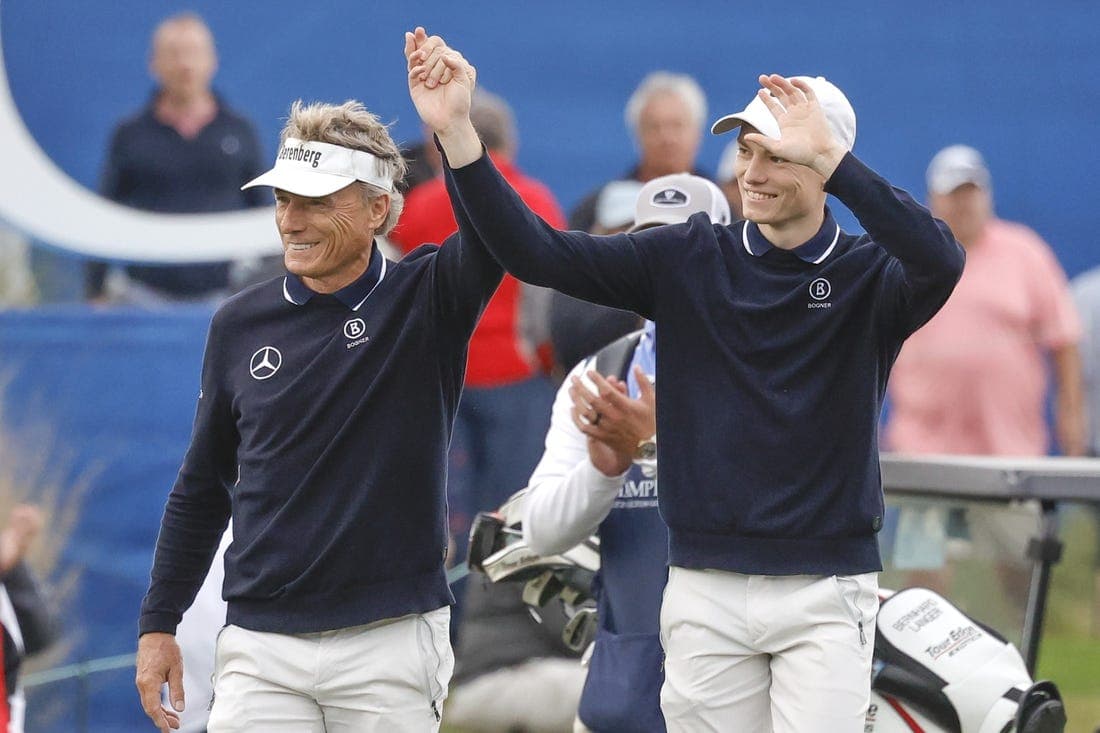 Dec 17, 2023; Orlando, Florida, USA; Bernhard Langer (left) and his son Jason Langer react to the crowd after they are announced walking onto the 18th green at the PNC Championship at The Ritz-Carlton Golf Club. Mandatory Credit: Reinhold Matay-USA TODAY Sports