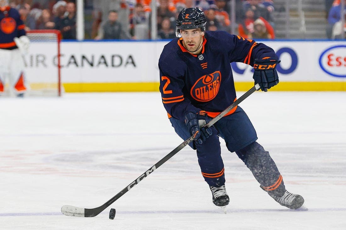Dec 14, 2023; Edmonton, Alberta, CAN; Edmonton Oilers defensemen Evan Bouchard (2) makes a pass against the Tampa Bay Lightning at Rogers Place. Mandatory Credit: Perry Nelson-USA TODAY Sports
