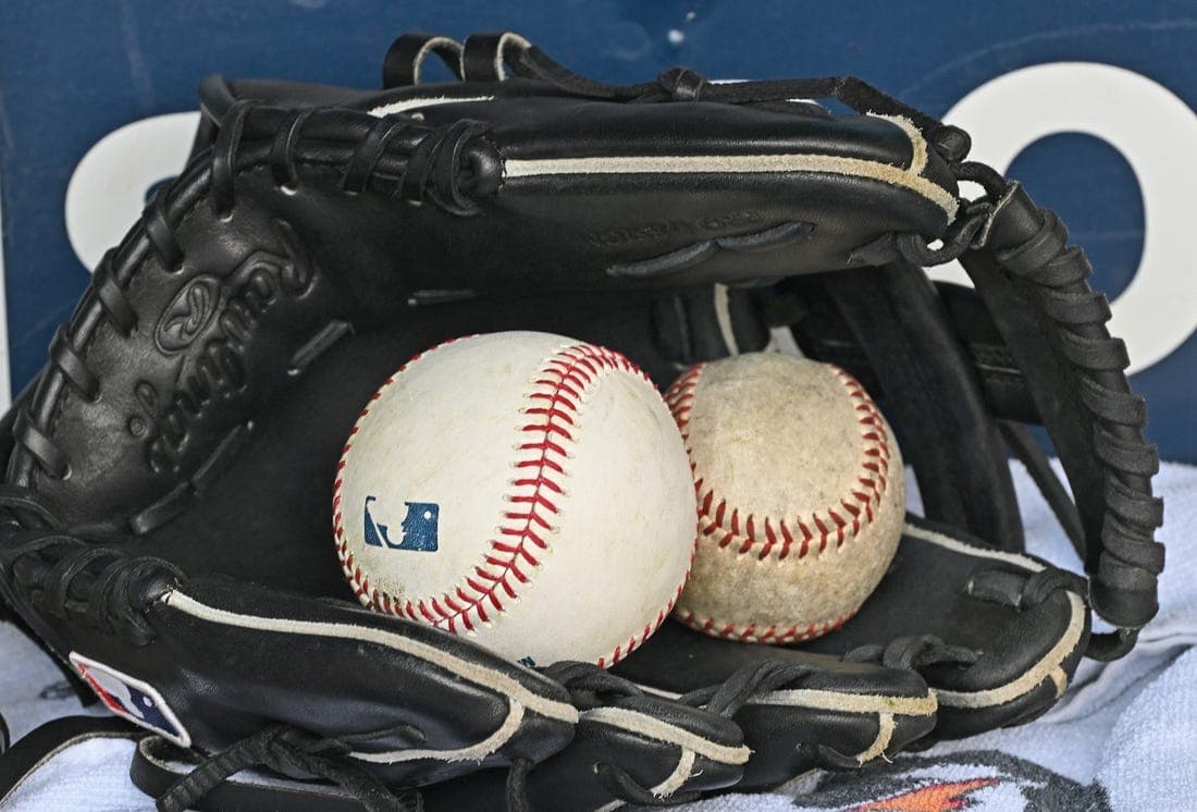 Aug 14, 2022; Kansas City, Missouri, USA; A general view of a baseball glove and baseballs prior to a game between the Kansas City Royals and Los Angeles Dodgers at Kauffman Stadium. Mandatory Credit: Peter Aiken-USA TODAY Sports