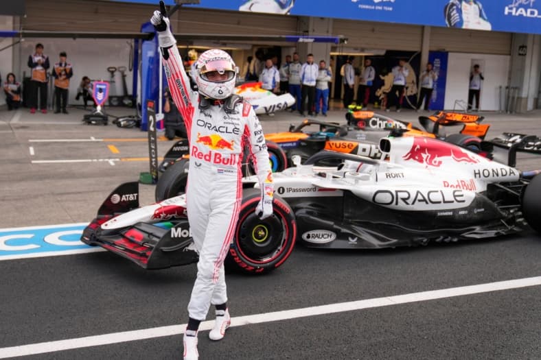 Red Bull driver Max Verstappen of the Netherlands celebrates after the qualifying session for the Japanese Formula One Grand…