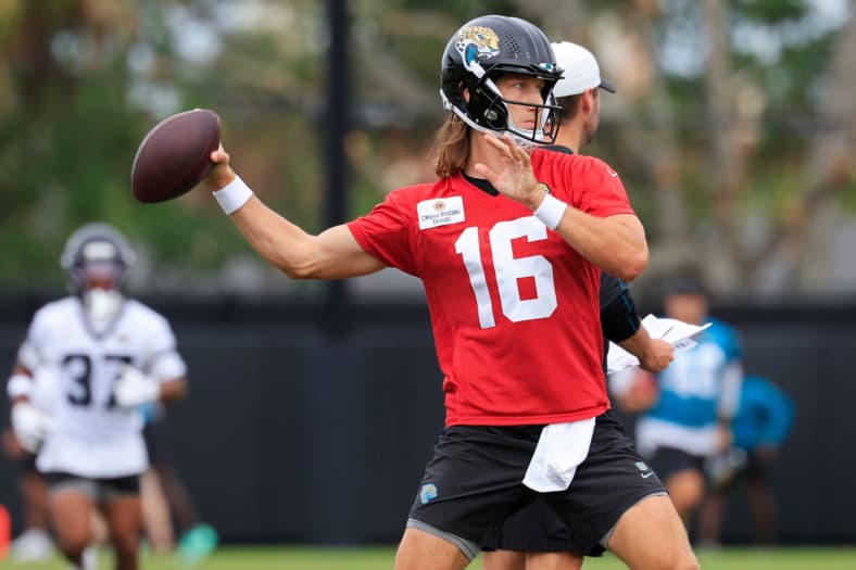 Jacksonville Jaguars quarterback Trevor Lawrence (16) looks to pass during the first day of minicamp at the Miller Electric