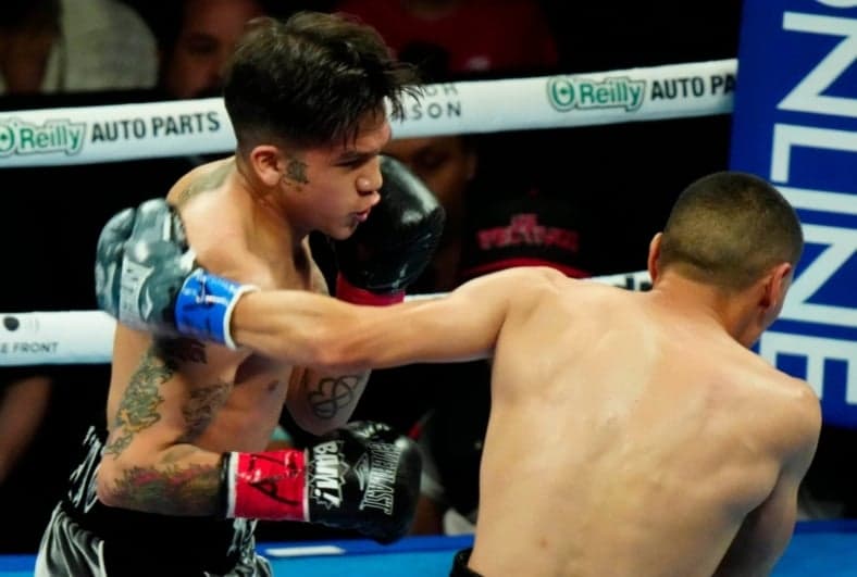 Jesse ‘Bam’ Rodriguez punches Juan Francisco Estrada (R) and during the Matchroom Boxing Main Event at the Footprint Center on