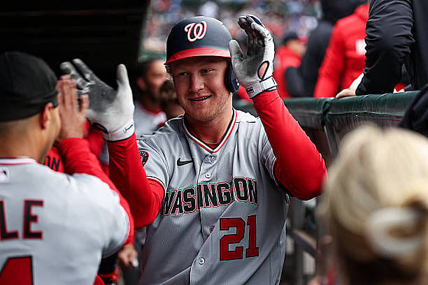 CHICAGO, IL – MARCH 26: Joey Wiemer #21 of the Washington Nationals celebrates in the dugout after hitting a solo home run i…