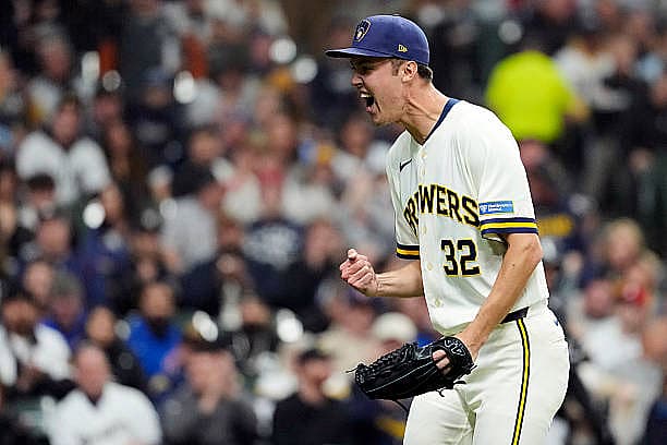 MILWAUKEE, WI – MARCH 26:  Jacob Misiorowski #32 of the Milwaukee Brewers celebrates as he walks back to the dugout during t…