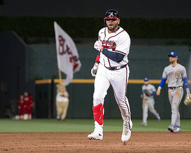 ATLANTA, GEORGIA – MARCH 28: Dominic Smith #8 of the Atlanta Braves runs to third base after hitting a game-winning grand sl…