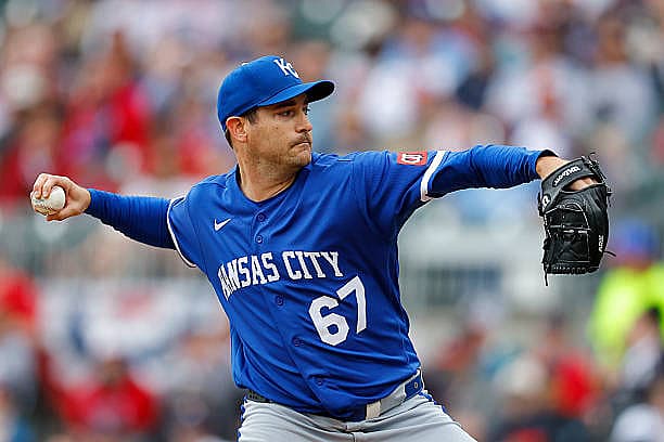 ATLANTA, GEORGIA – MARCH 29: Seth Lugo #67 of the Kansas City Royals pitches during the first inning against the Atlanta Bra…