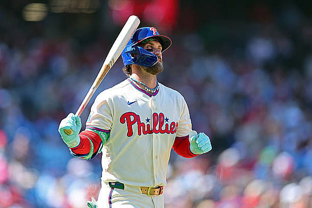 PHILADELPHIA, PENNSYLVANIA – MARCH 29: Bryce Harper #3 of the Philadelphia Phillies reacts after lining out in the first inn…