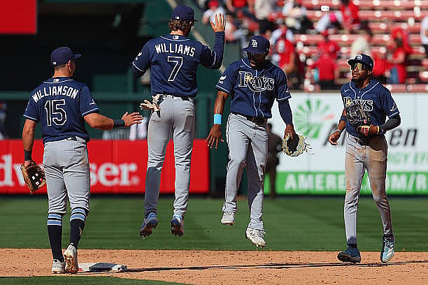 ST LOUIS, MISSOURI – MARCH 29: Carson Williams #7 and Jonny DeLuca #21 both of the Tampa Bay Rays celebrate after beating th…