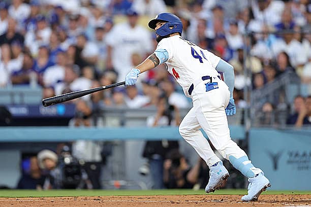 LOS ANGELES, CALIFORNIA – MARCH 26: Andy Pages #44 of the Los Angeles Dodgers hits a three-run home run during the fifth inn…