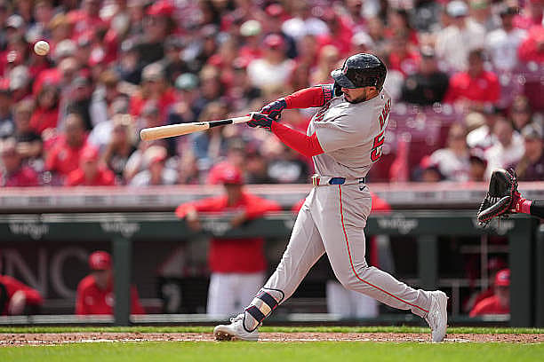 CINCINNATI, OHIO – MARCH 29: Wilyer Abreu #52 of the Boston Red Sox hits a two-run home run during the fourth inning of a ba…