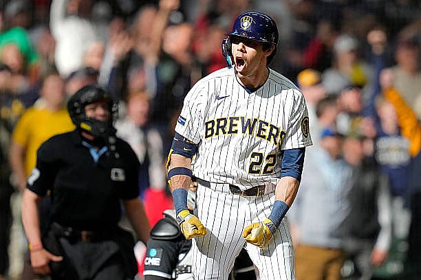 MILWAUKEE, WISCONSIN – MARCH 29: Christian Yelich #22 of the Milwaukee Brewers reacts after hitting a three-run homer to tak…
