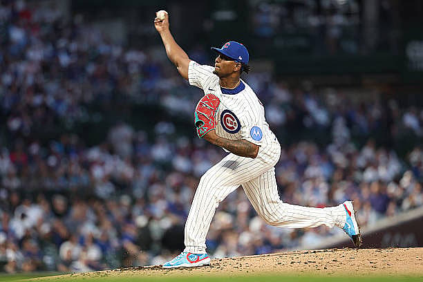 CHICAGO, ILLINOIS – MARCH 30: Edward Cabrera #30 of the Chicago Cubs delivers a pitch against the Los Angeles Angels during…