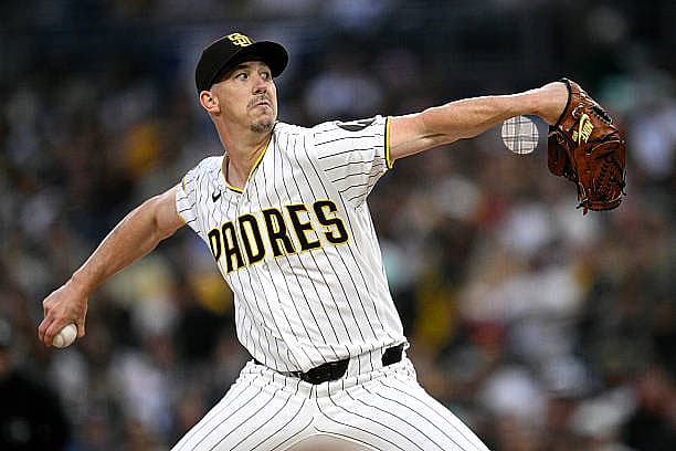 SAN DIEGO, CALIFORNIA – MARCH 30: Walker Buehler #10 of the San Diego Padres pitches against the San Francisco Giants during…