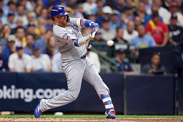 MILWAUKEE, WISCONSIN – OCTOBER 06: Justin Turner #3 of the Chicago Cubs hits a single during the second inning against the M…