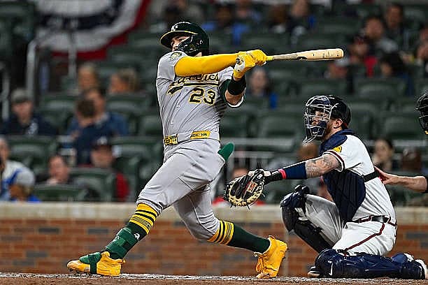 ATLANTA, GA – MARCH 30:  Athletics catcher Shea Langeliers (23) swings at a pitch during the MLB game between the Athletics…