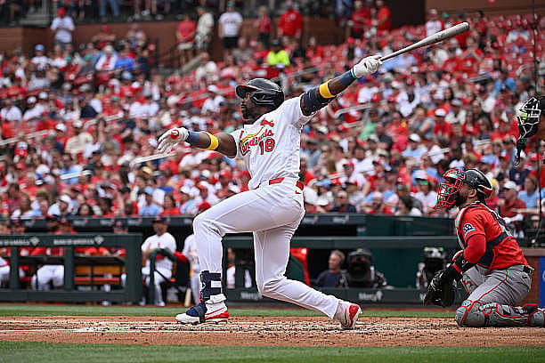 ST LOUIS, MISSOURI – APRIL 12: Jordan Walker #18 of the St. Louis Cardinals hits a solo home run against the Boston Red Sox…