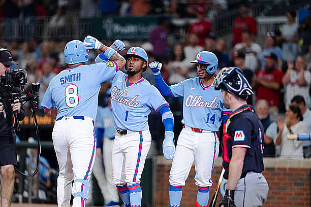 ATLANTA, GA – APRIL 12: Dominic Smith #8 of the Atlanta Braves celebrates with Ozzie Albies #1 of the Atlanta Braves after h…