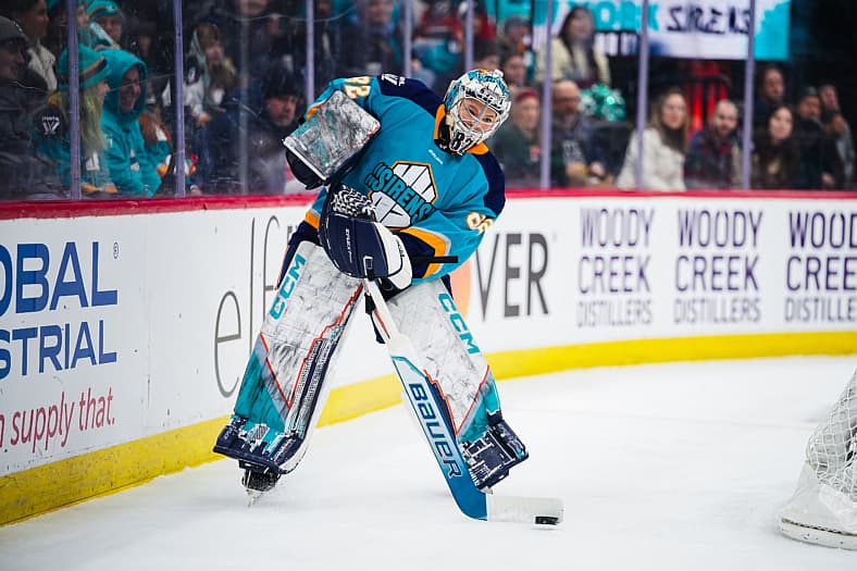New York Sirens goalie Kayle Osborne plays the puck outside the crease.