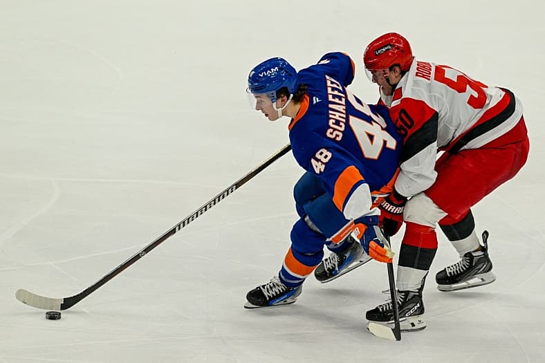 Apr 14, 2026; Elmont, New York, USA;  Carolina Hurricanes left wing Eric Robinson (50) defends against New York Islanders de…
