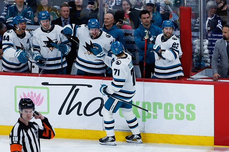 Apr 16, 2026; Winnipeg, Manitoba, CAN;  San Jose Sharks forward Macklin Celebrini (71) is congratulated by his team mates on…