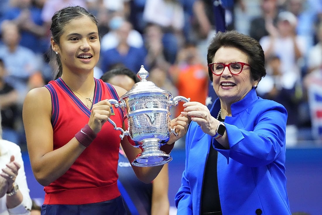Sep 11, 2021; Flushing, NY, USA; Emma Raducanu of Great Britain (L) is presented the championship trophy by Billie Jean King (R) after her match against Leylah Fernandez of Canada (not pictured) in the women