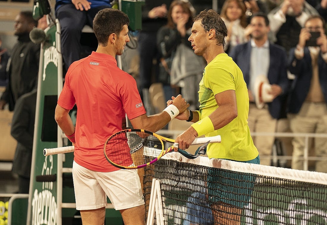 May 31, 2022; Paris, France; Rafael Nadal (ESP) at the net with Novak Djokovic (SRB) after their match on day 10 of the French Open at Stade Roland-Garros. Nadal won 6-2, 4-6, 6-2, 7-6 (4). Mandatory Credit: Susan Mullane-USA TODAY Sports