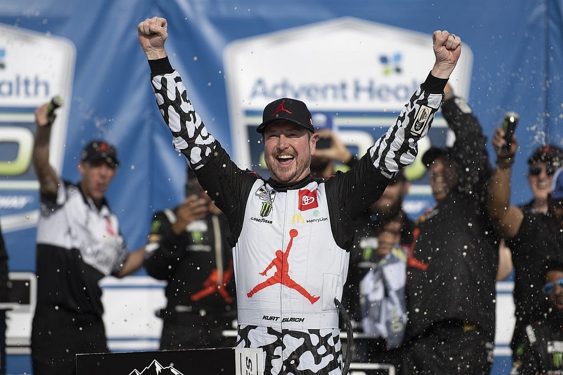 May 15, 2022; Kansas City, Kansas, USA; NASCAR Cup Series driver Kurt Busch (45) celebrates on victory lane after winning the AdventHealth 400 at Kansas Speedway. Mandatory Credit: Amy Kontras-USA TODAY Sports