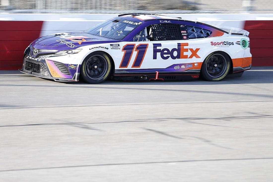 Apr 3, 2022; Richmond, Virginia, USA; NASCAR Cup Series driver Denny Hamlin (11) races during the Toyota Owners 400 at Richmond International Raceway. Mandatory Credit: Amber Searls-USA TODAY Sports