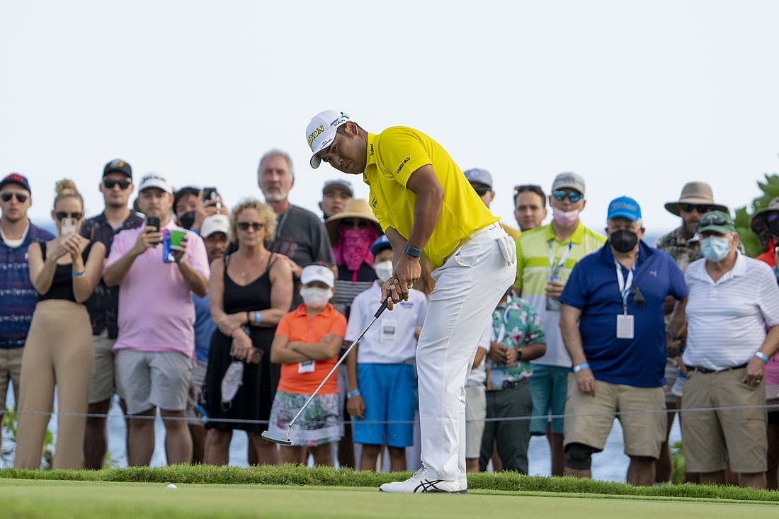 January 16, 2022; Honolulu, Hawaii, USA; Hideki Matsuyama putts on the 17th hole during the final round of the Sony Open in Hawaii golf tournament at Waialae Country Club. Mandatory Credit: Kyle Terada-USA TODAY Sports