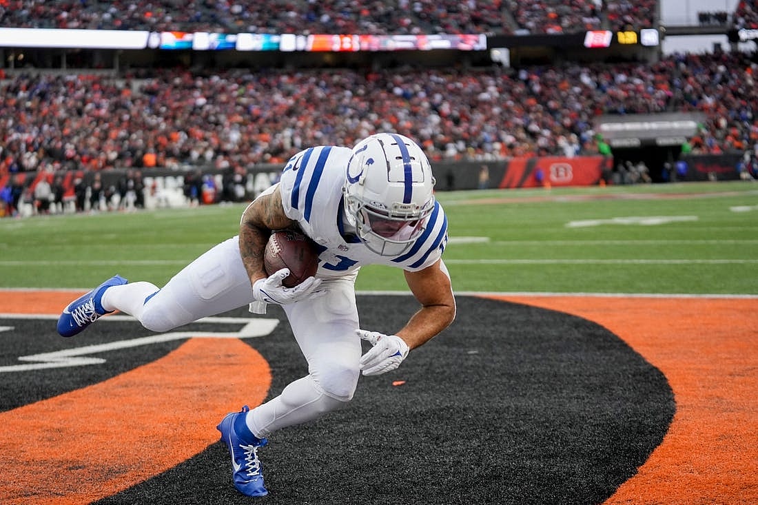 Indianapolis Colts wide receiver Michael Pittman Jr. (11) brings a pass down in the end zone for a two-point conversion Sunday, Dec. 10, 2023, during a game against the Cincinnati Bengals at Paycor Stadium in Cincinnati.