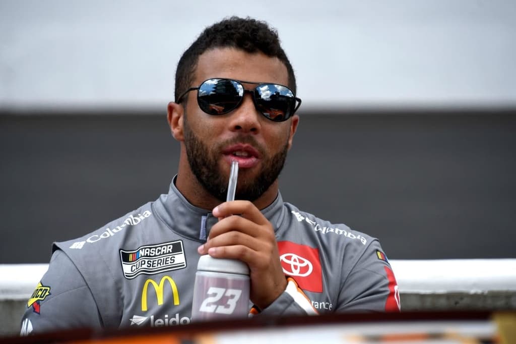 NASCAR Cup Series driver Bubba Wallace (23) sips on a drink Sunday, July 31, 2022, before the Verizon 200 at the Brickyard at Indianapolis Motor Speedway.