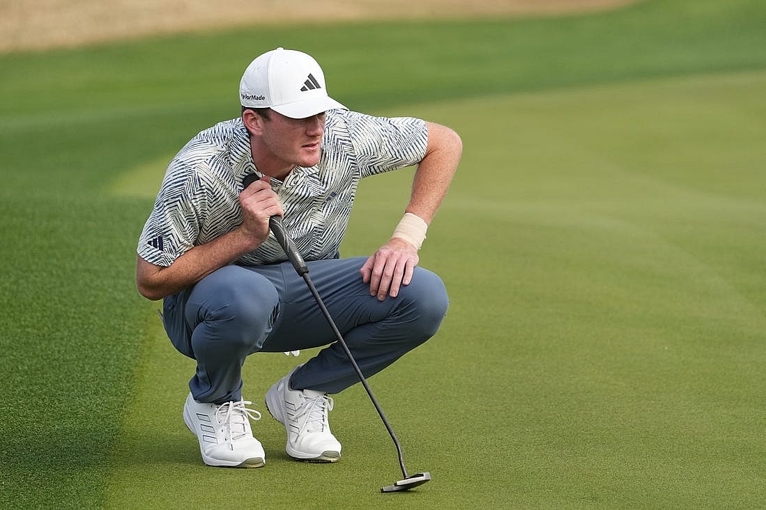 Jan 21, 2024; La Quinta, California, USA; Nick Dunlap lines up a putt on the third green during the final round of The American Express golf tournament at PGA West Stadium Course. Mandatory Credit: Ray Acevedo-USA TODAY Sports