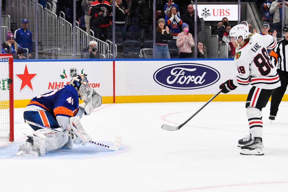 Dec 5, 2021; Elmont, New York, USA; Chicago Blackhawks right wing Patrick Kane (88) scores the wining goal on New York Islanders goaltender Semyon Varlamov (40) during shootouts  at UBS Arena. Mandatory Credit: Dennis Schneidler-USA TODAY Sports