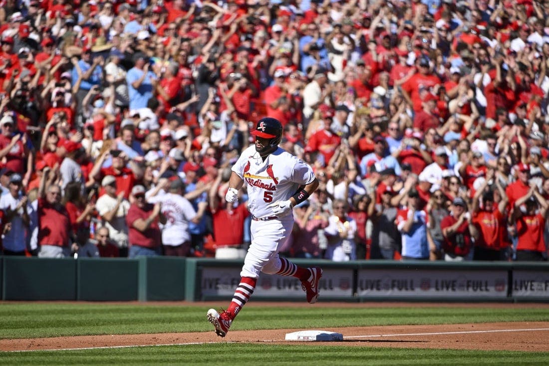 St. Louis Cardinals first baseman Albert Pujols (5) runs the bases after hitting a solo home run for his 702nd career home run during the third inning against the Pittsburgh Pirates at Busch Stadium. Mandatory Credit: Jeff Curry-USA TODAY Sports