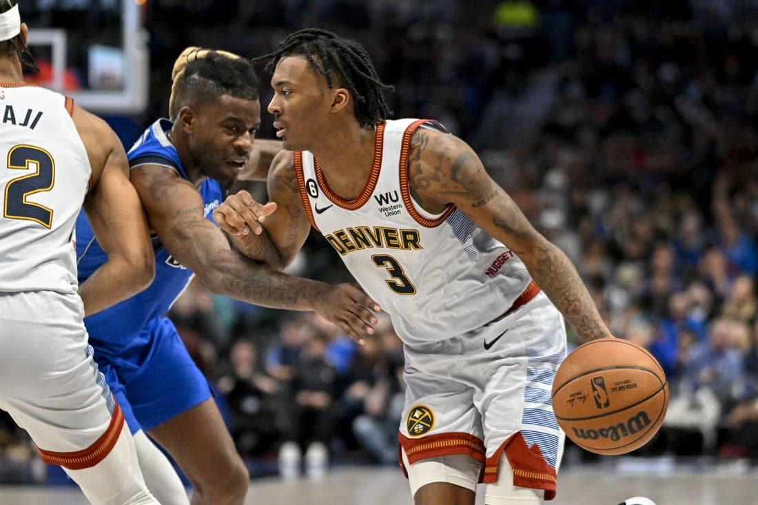 Nov 18, 2022; Dallas, Texas, USA; Denver Nuggets guard Bones Hyland (3) drives to the basket past Dallas Mavericks forward Reggie Bullock (25) during the second half at the American Airlines Center. Mandatory Credit: Jerome Miron-USA TODAY Sports