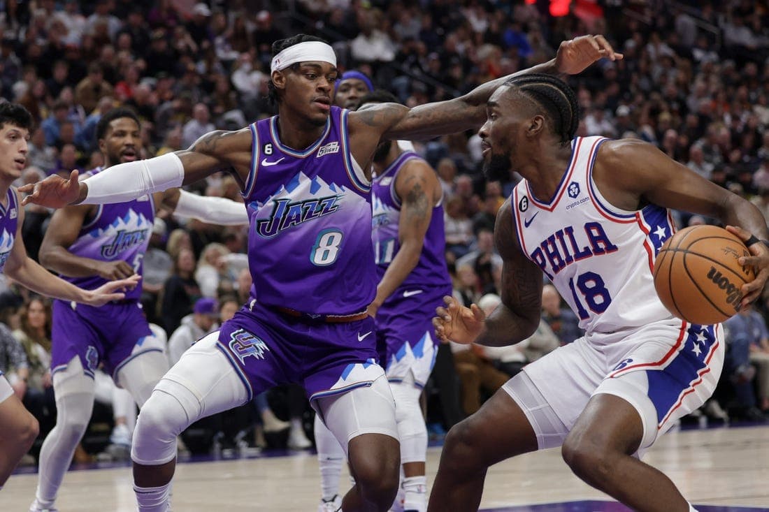 Jan 14, 2023; Salt Lake City, Utah, USA; Philadelphia 76ers guard Shake Milton (18) keeps the ball away from Utah Jazz forward Jarred Vanderbilt (8) during the second quarter at Vivint Arena. Mandatory Credit: Chris Nicoll-USA TODAY Sports