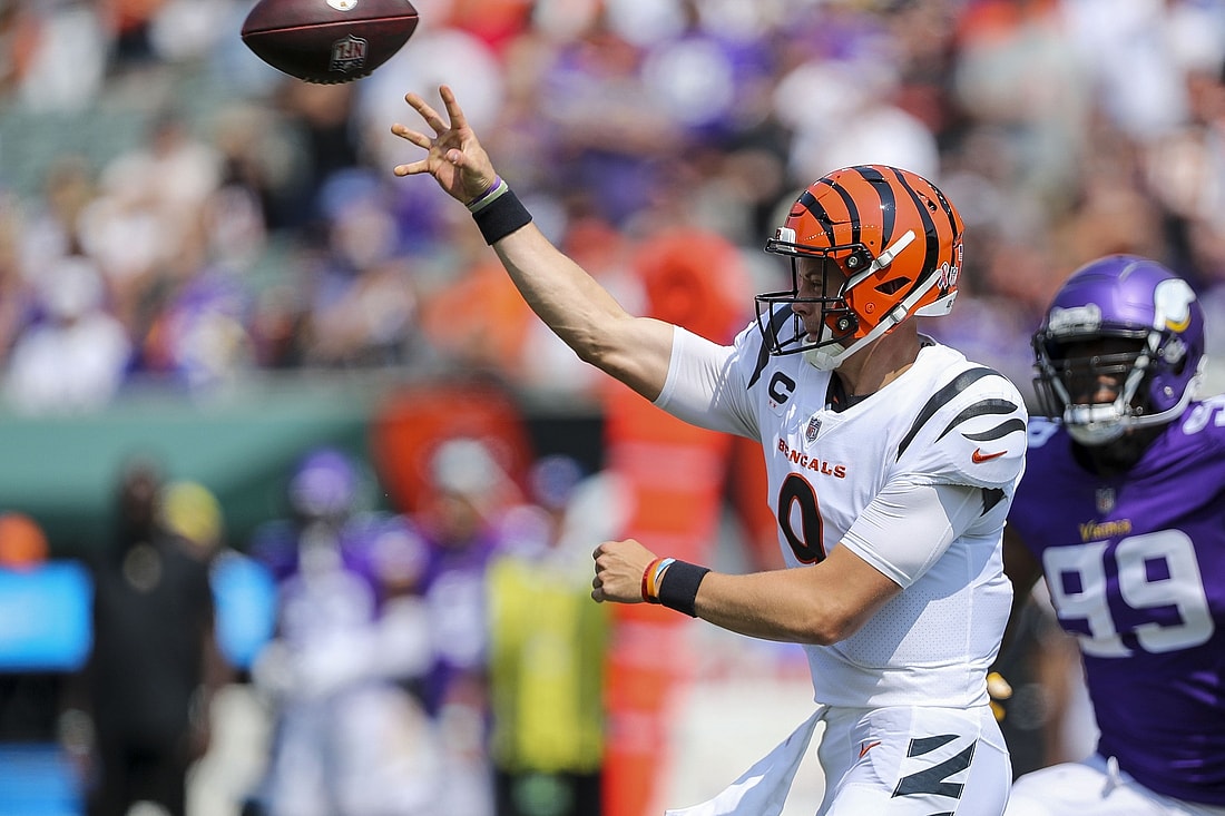 Sep 12, 2021; Cincinnati, Ohio, USA; Cincinnati Bengals quarterback Joe Burrow (9) throws a pass against the Minnesota Vikings in the first half at Paul Brown Stadium. Mandatory Credit: Katie Stratman-USA TODAY Sports
