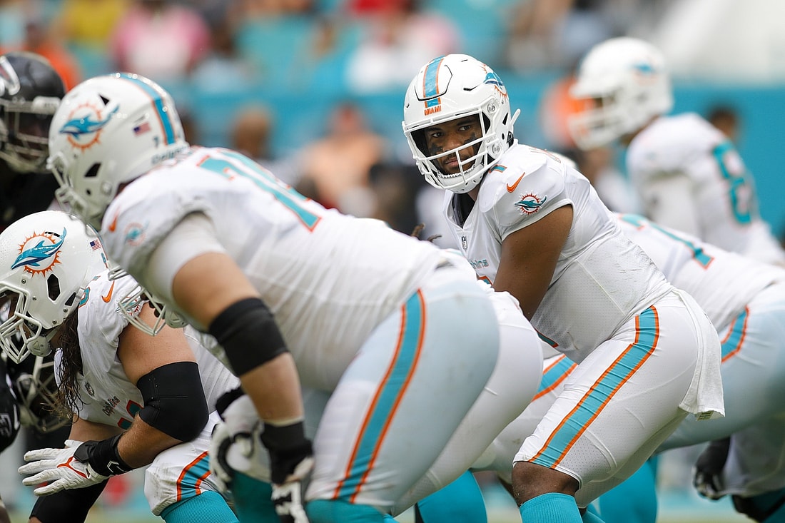 Oct 24, 2021; Miami Gardens, Florida, USA; Miami Dolphins quarterback Tua Tagovailoa (1) looks on prior the snap against the Atlanta Falcons during the second quarter of the game at Hard Rock Stadium. Mandatory Credit: Sam Navarro-USA TODAY Sports