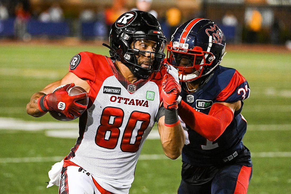 Sep 2, 2022; Montreal, Quebec, CAN; Montreal Alouettes defensive back Wesley Sutton (37) tackles Ottawa Redblacks wide receiver Nate Behar (80) during the fourth quarter at Percival Molson Memorial Stadium. Mandatory Credit: David Kirouac-USA TODAY Sports