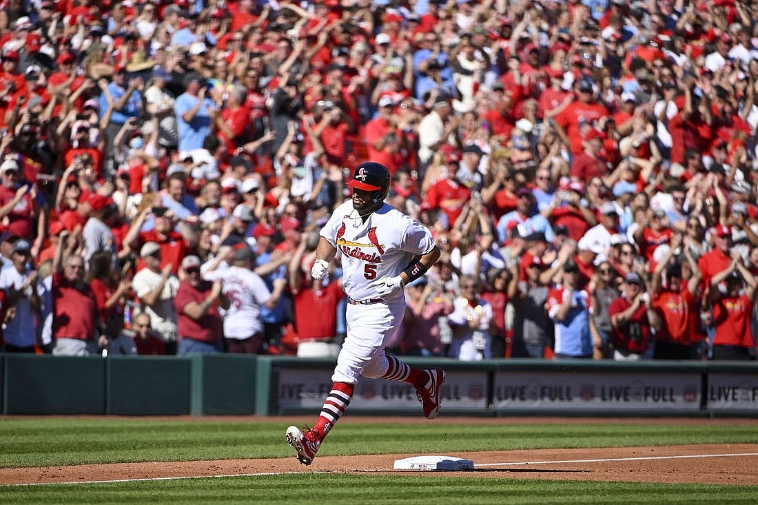 St. Louis Cardinals first baseman Albert Pujols (5) runs the bases after hitting a solo home run for his 702nd career home run during the third inning against the Pittsburgh Pirates at Busch Stadium. Mandatory Credit: Jeff Curry-USA TODAY Sports