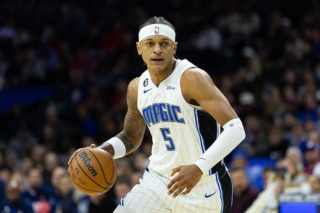 Jan 30, 2023; Philadelphia, Pennsylvania, USA; Orlando Magic forward Paolo Banchero (5) dribbles the ball against the Philadelphia 76ers during the first quarter at Wells Fargo Center. Mandatory Credit: Bill Streicher-USA TODAY Sports