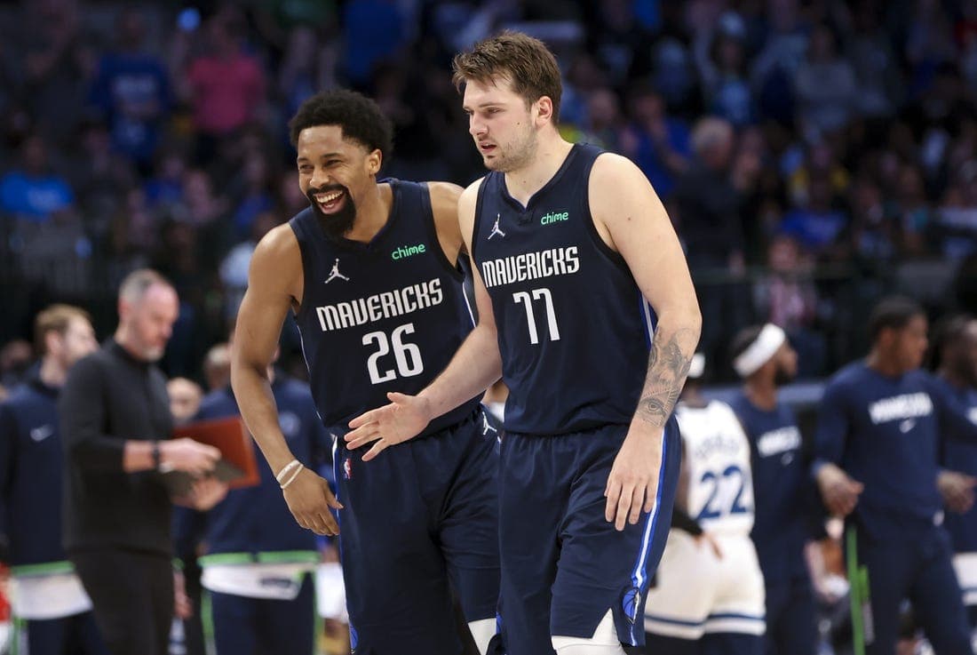 Mar 21, 2022; Dallas, Texas, USA; Dallas Mavericks guard Luka Doncic (77) celebrates with Dallas Mavericks guard Spencer Dinwiddie (26) during the fourth quarter against the Minnesota Timberwolves at American Airlines Center. Mandatory Credit: Kevin Jairaj-USA TODAY Sports