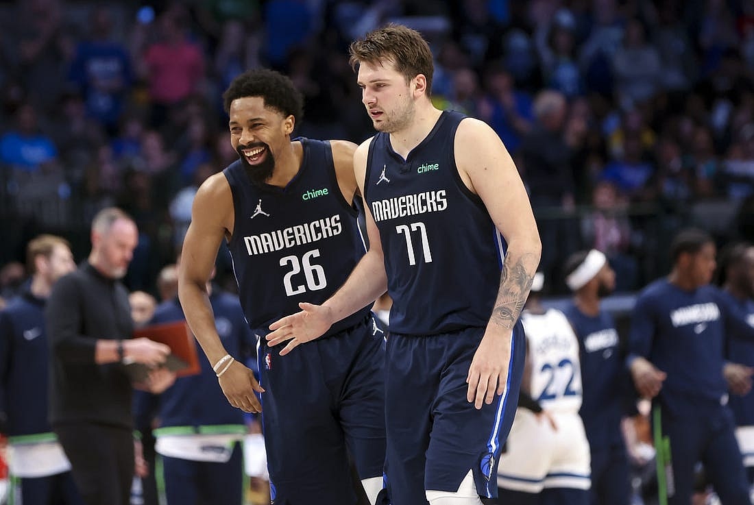 Mar 21, 2022; Dallas, Texas, USA;  Dallas Mavericks guard Luka Doncic (77) celebrates with Dallas Mavericks guard Spencer Dinwiddie (26) during the fourth quarter against the Minnesota Timberwolves at American Airlines Center. Mandatory Credit: Kevin Jairaj-USA TODAY Sports