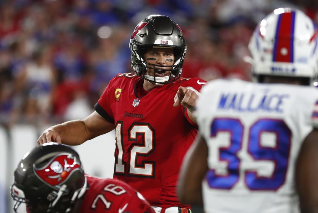 Dec 12, 2021; Tampa, Florida, USA;Tampa Bay Buccaneers quarterback Tom Brady (12) points against the Buffalo Bills  during the first half at Raymond James Stadium. Mandatory Credit: Kim Klement-USA TODAY Sports