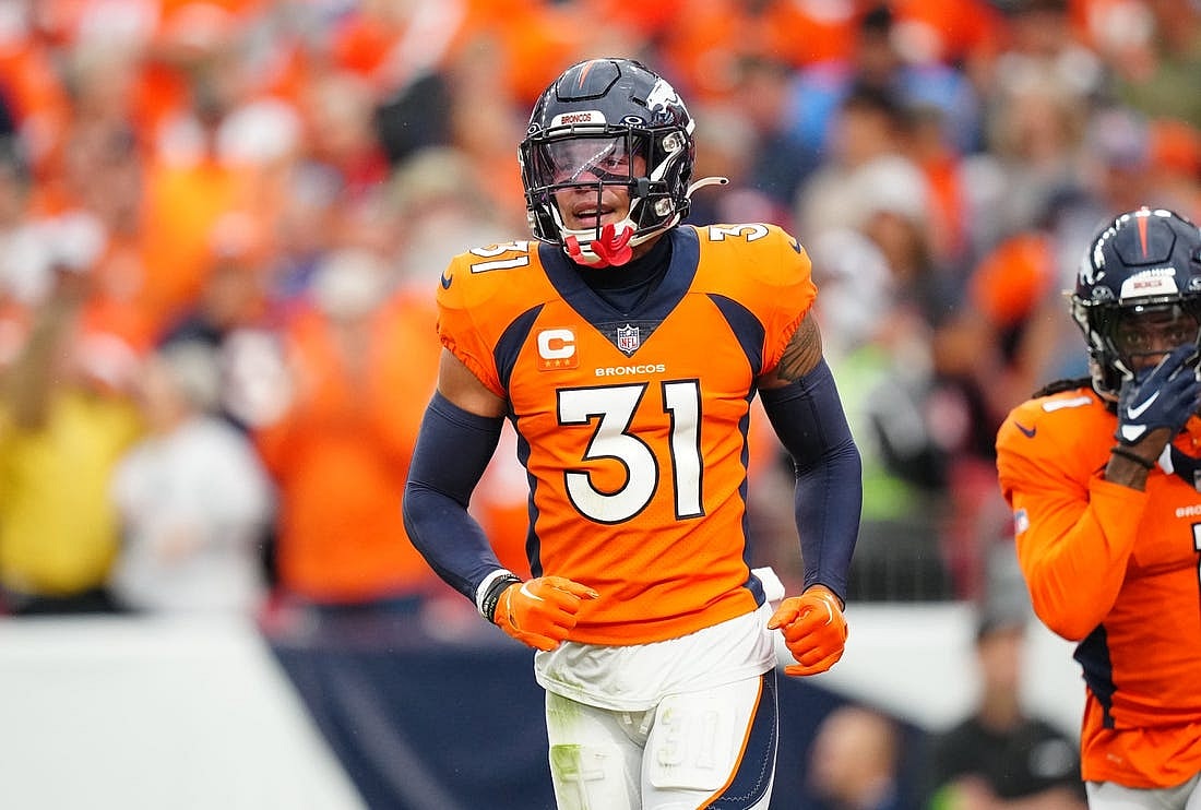 Sep 10, 2023; Denver, Colorado, USA; Denver Broncos safety Justin Simmons (31) reacts to a turnover in the third quarter against the Las Vegas Raiders at Empower Field at Mile High. Mandatory Credit: Ron Chenoy-USA TODAY Sports