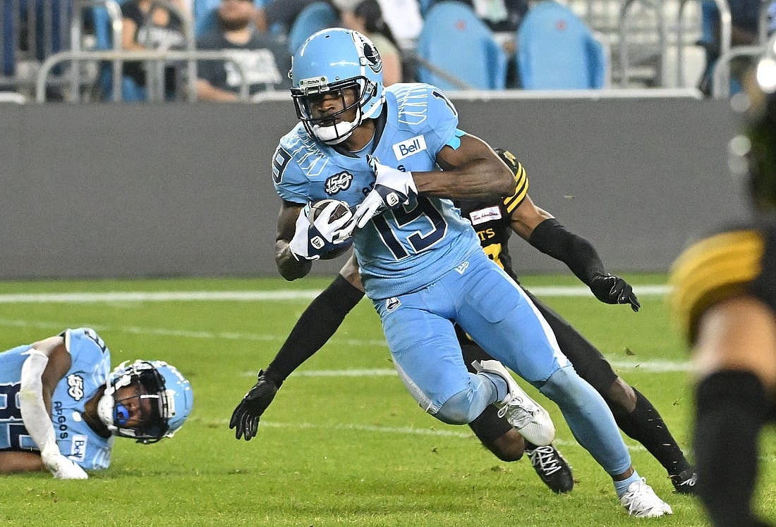 Jun 18, 2023; Toronto, Ontario, CAN; Toronto Argonauts wide receiver Kurleigh Gittens Jr. (19) runs with the ball after catching a pass against the Hamilton Tiger-Cats in the fourth quarter at BMO Field. Mandatory Credit: Dan Hamilton-USA TODAY Sports