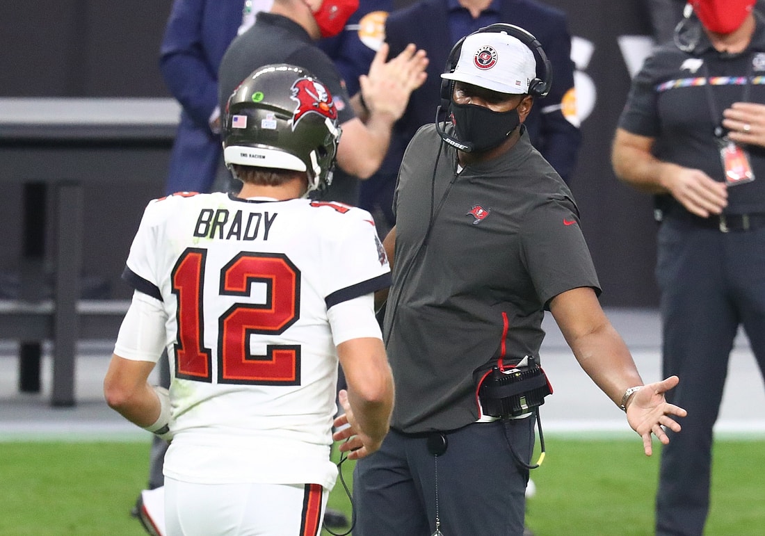 Oct 25, 2020; Paradise, Nevada, USA; Tampa Bay Buccaneers quarterback Tom Brady (12) with offensive coordinator Byron Leftwich against the Las Vegas Raiders at Allegiant Stadium. Mandatory Credit: Mark J. Rebilas-USA TODAY Sports