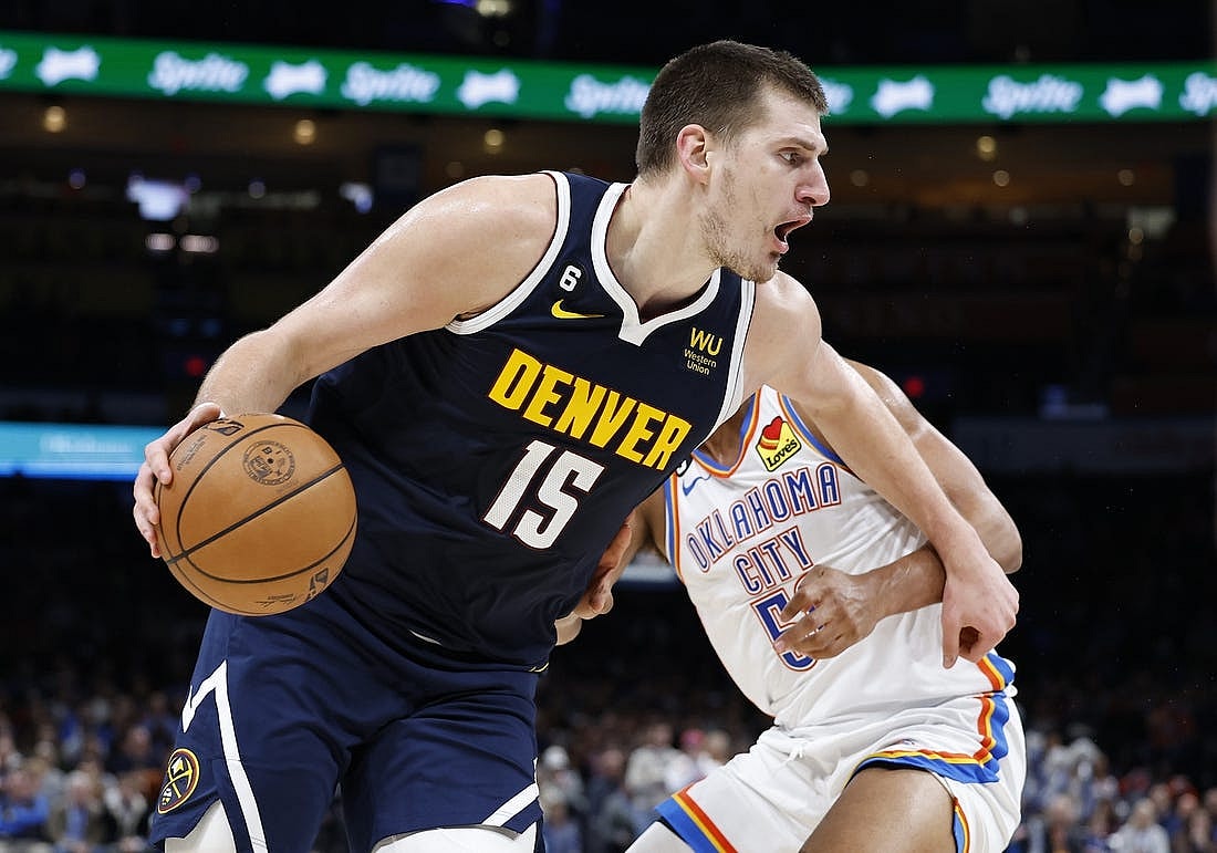 Nov 23, 2022; Oklahoma City, Oklahoma, USA; Denver Nuggets center Nikola Jokic (15) drives to the basket against Oklahoma City Thunder forward Darius Bazley (55) during the second quarter at Paycom Center. Mandatory Credit: Alonzo Adams-USA TODAY Sports